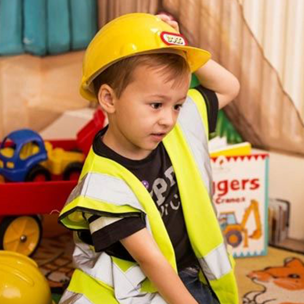 boy dressing in builders uniform