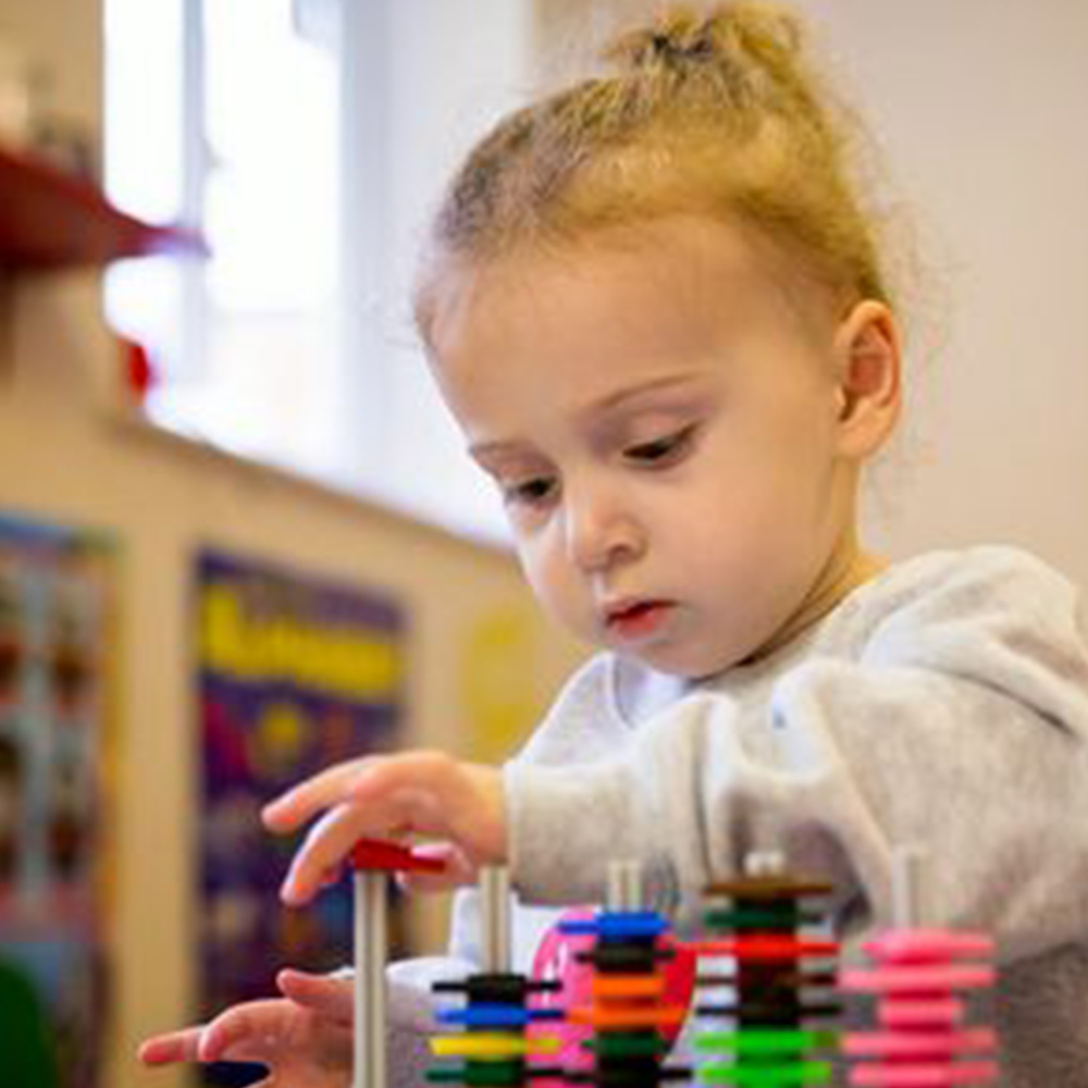 girl playing with toy